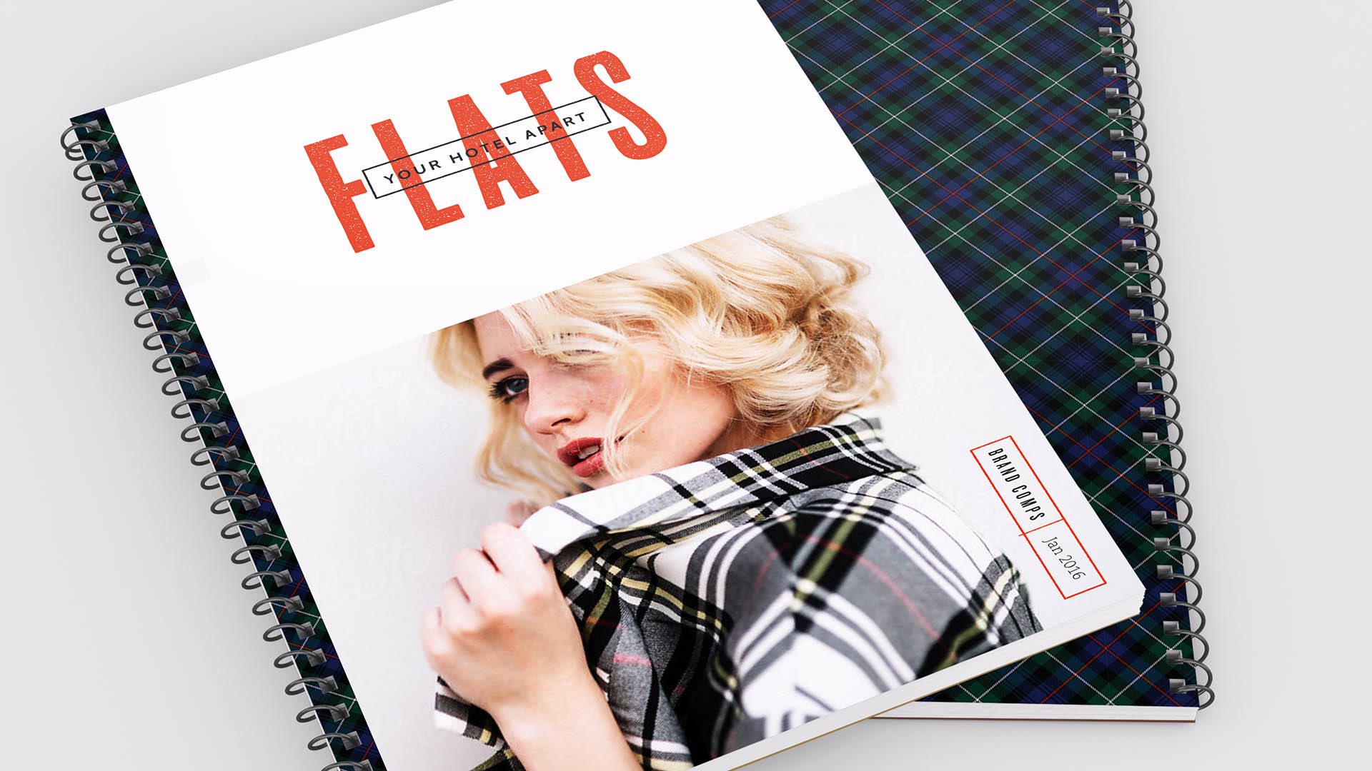 A magazine with plaid on it and the word 